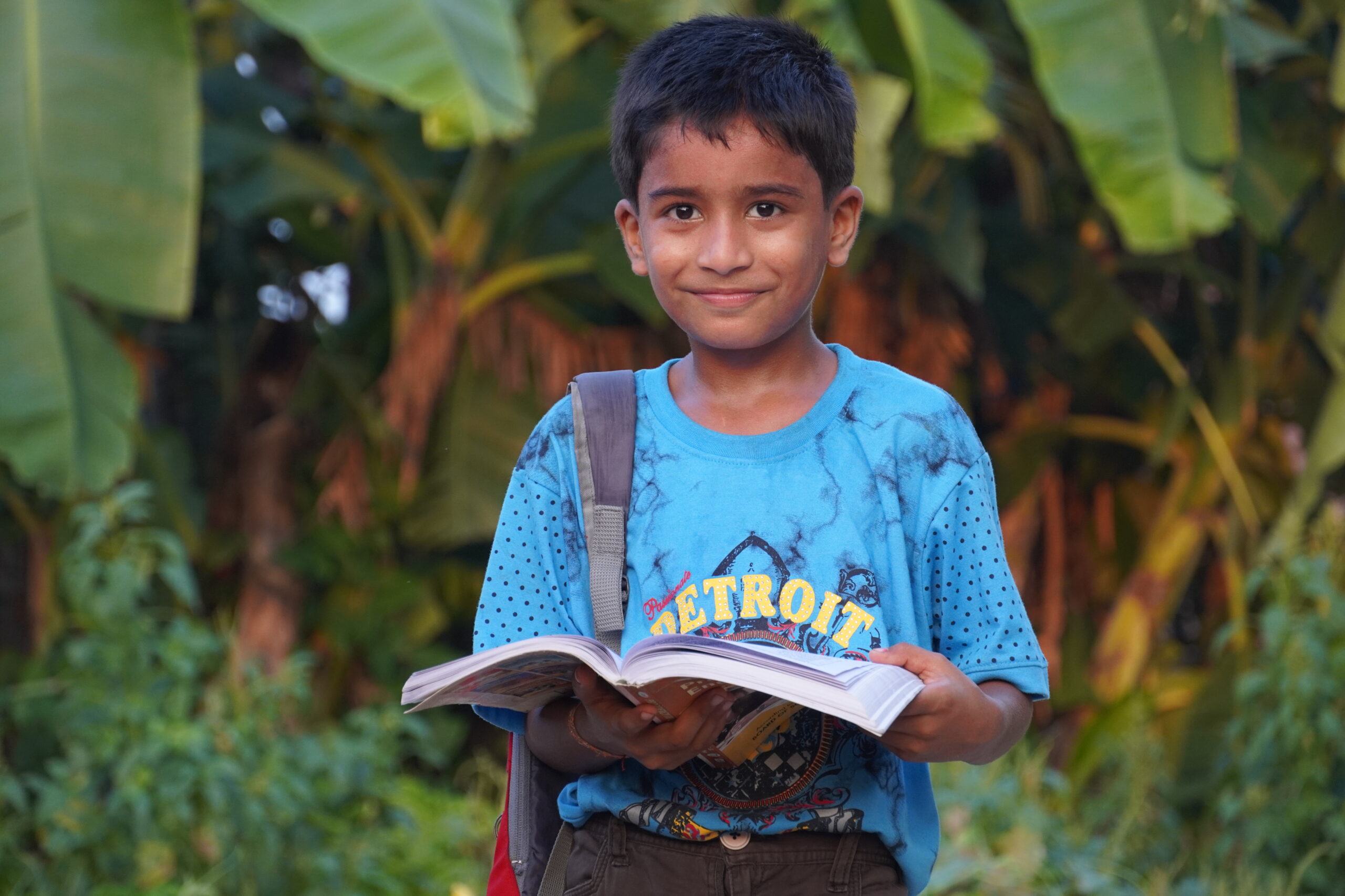 A student kid with books - child education concept